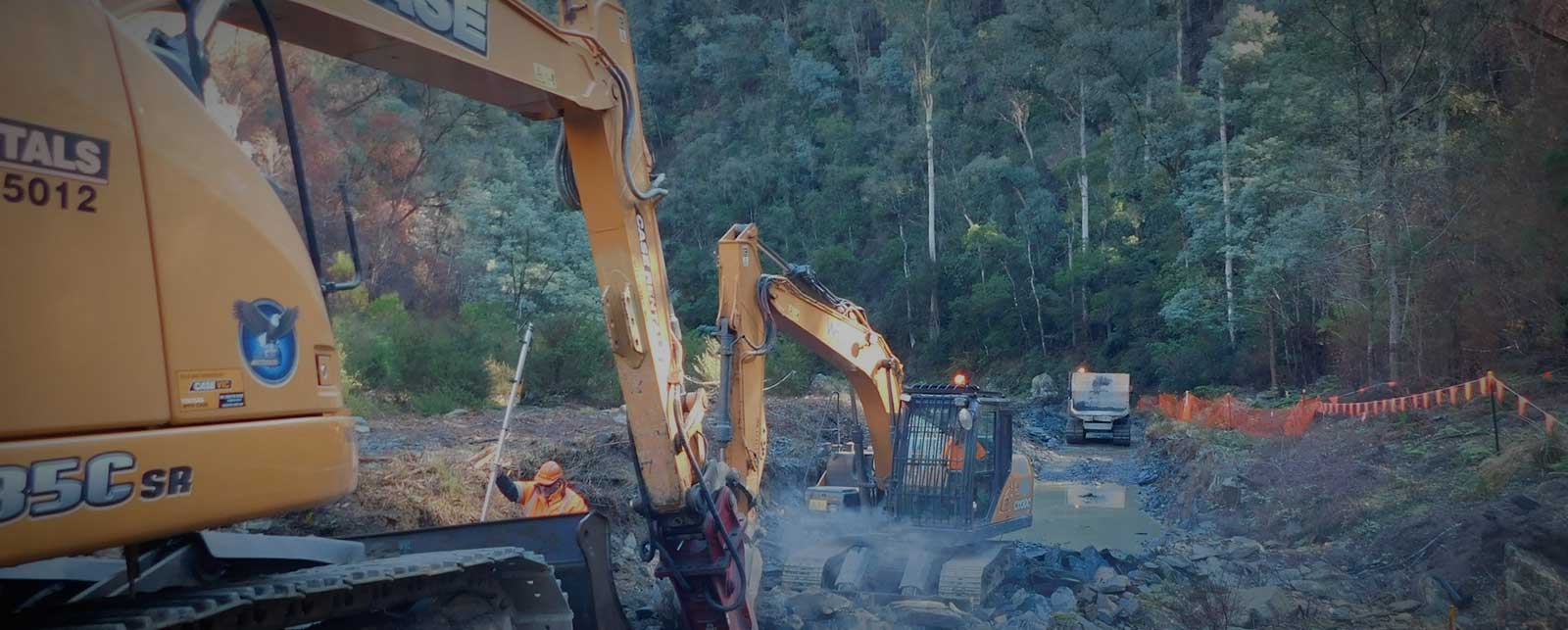 Excavators working on construction site.